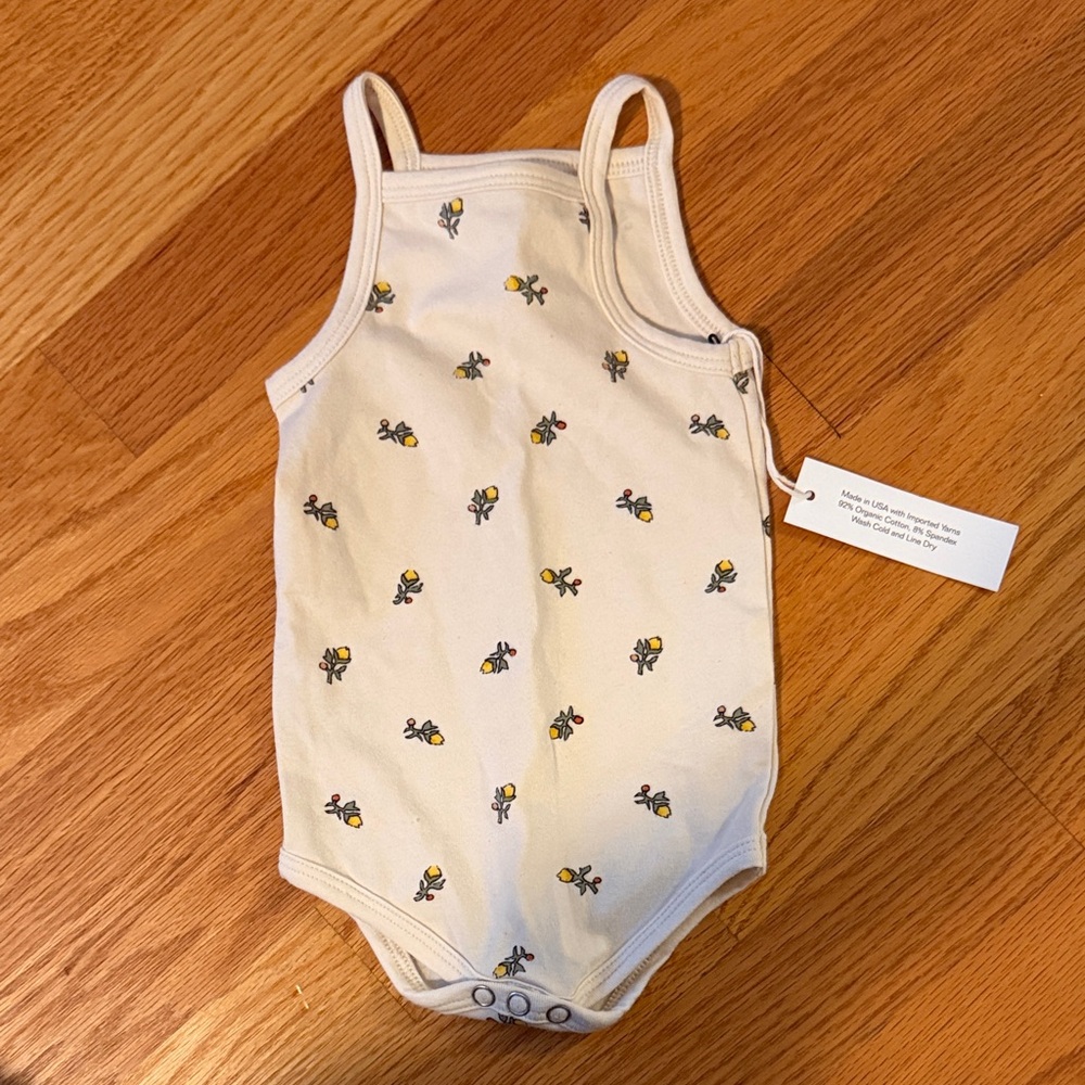 ARQ Cream flower Onsie 0-3 months NWT